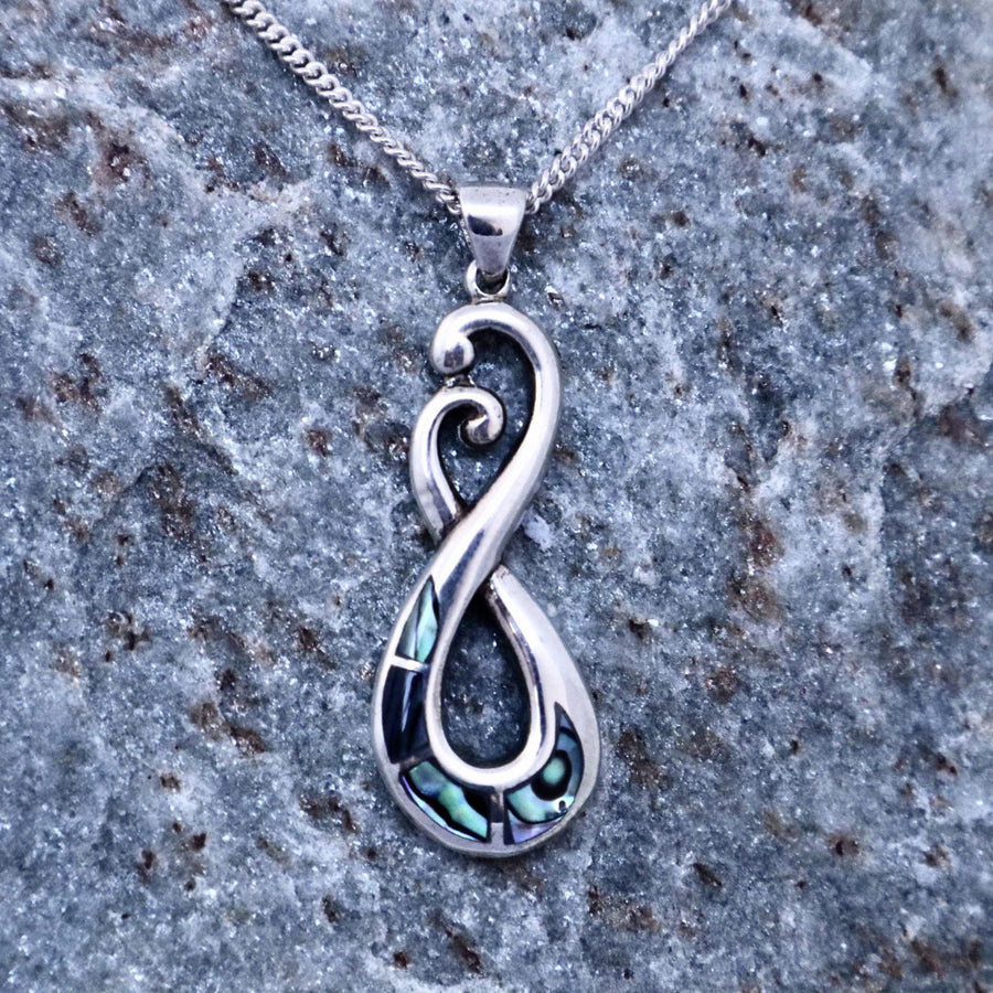 paua shell and sterling silver crossing koru pendant